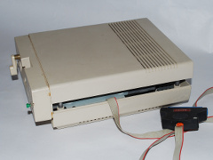A modified Commodore 1541-II disk drive with a speed loader system.