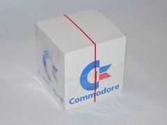 A memo block with the Commodore logo.