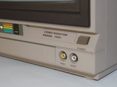 The audio and video connectors at the front of the Commodore 1701 monitor.